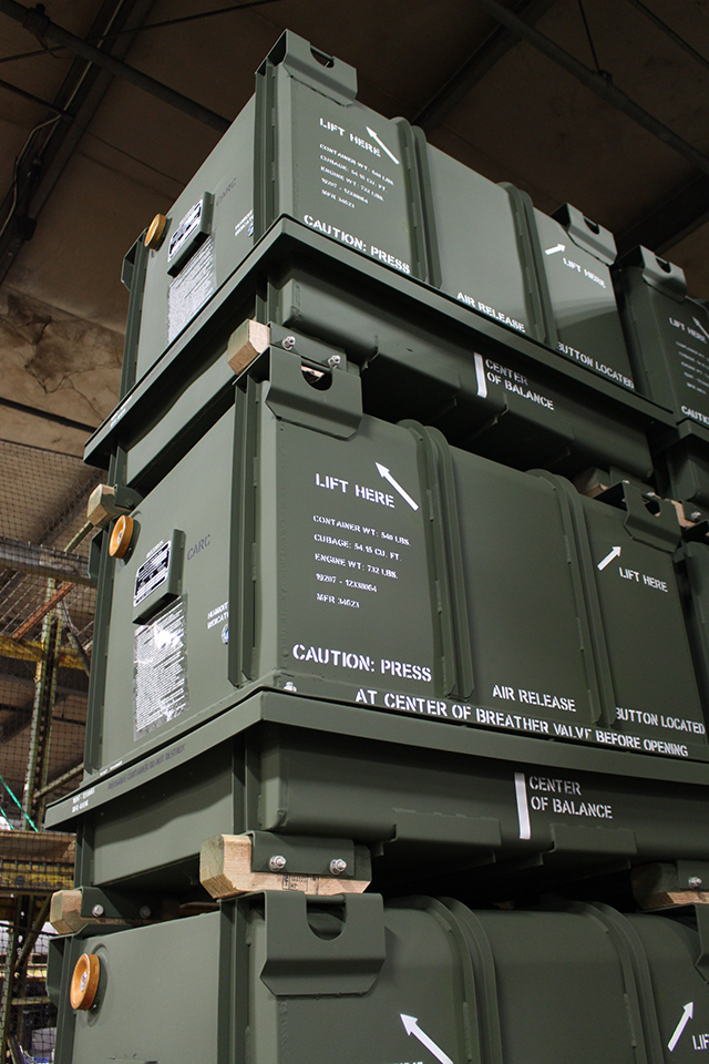 Armor Contract Manufacturing Green Shipping Containers Stacked